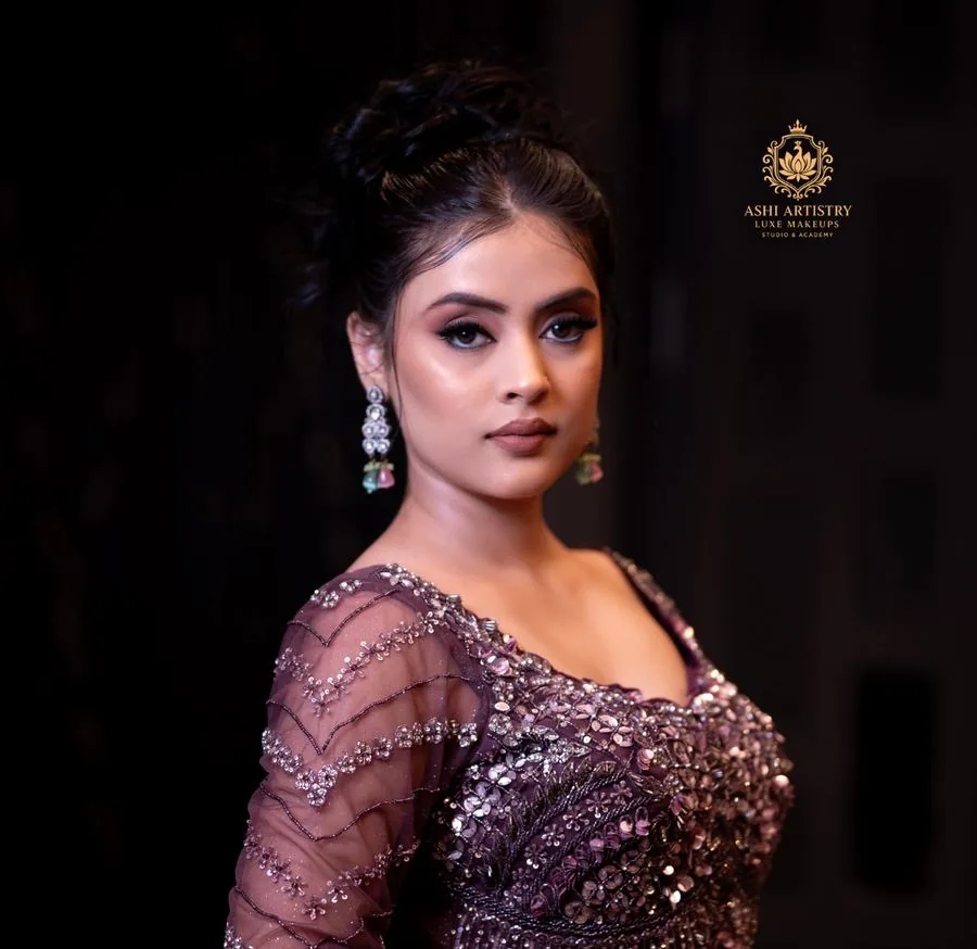 Editorial portrait in a jewel-toned sequinned gown