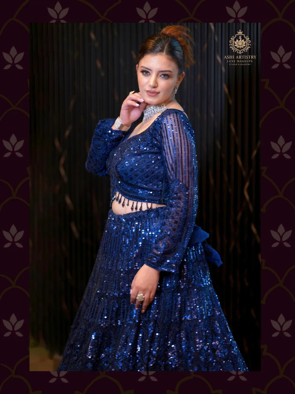 Editorial portrait in a navy sequinned gown with a fan prop