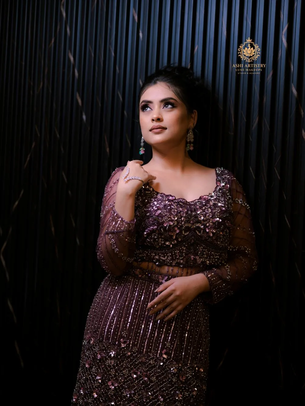 Editorial portrait in a maroon sequinned gown