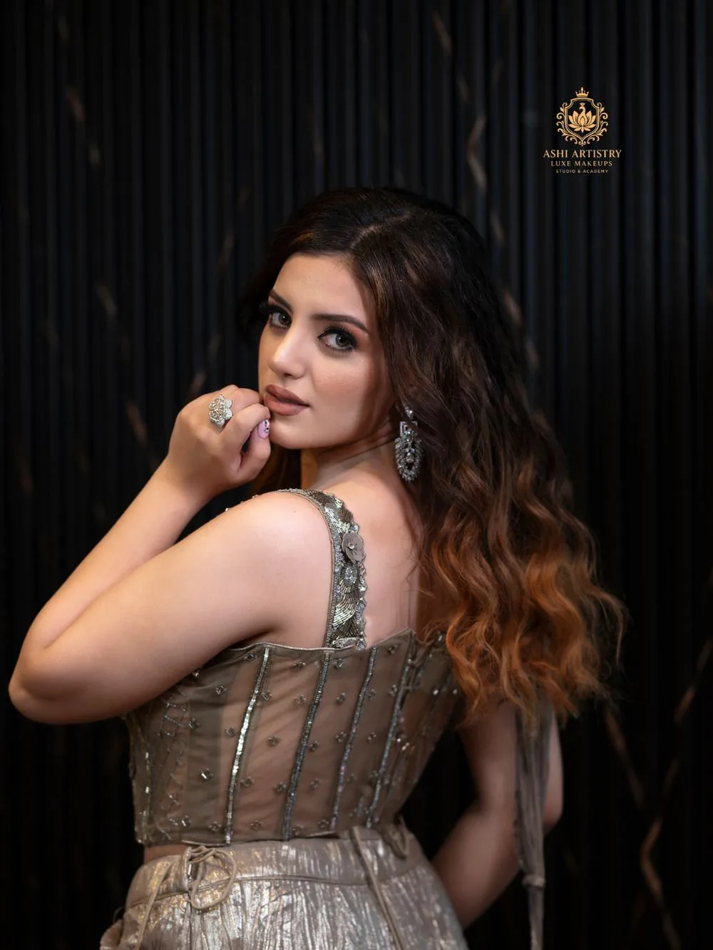 Two editorial portraits side by side in shimmering gowns