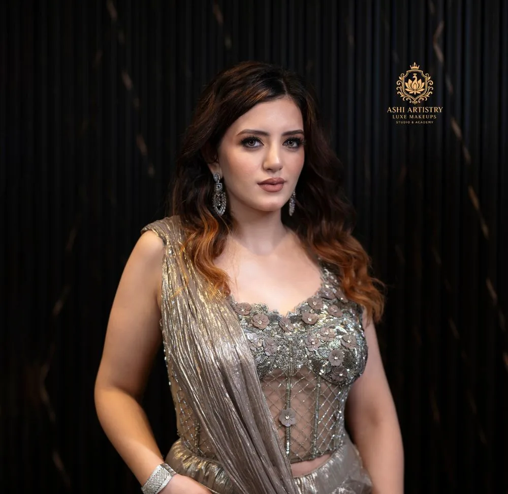 Finishing touches on a gold-draped bridal look